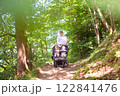 Father with children in all terrain stroller 122841476