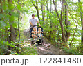Father with children in all terrain stroller 122841480