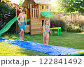 Kids playing in swimming pool 122841492