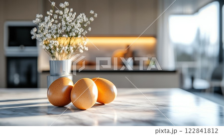 Brown Easter Eggs and Fragile White Flowers in a Modern Kitchen, Minimalist Easter Decor. 122841812