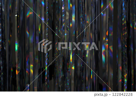 Selective focus on silver foil jewelry forming a photo zone for a birthday, anniversary, or New Year's Eve party. The concept of celebrating Christmas and New Year. High quality photo 122842228