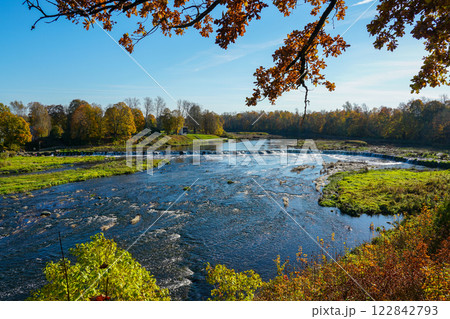 Picturesque autumn landscape of the widest European waterfall on the Venta River in Latvia Picturesque autumn landscape of the widest European waterfall on the Venta River in Latvia 122842793