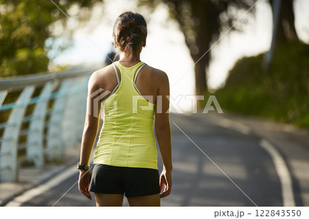 young asian woman jogging running in park 122843550