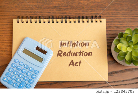 Inflation Reduction Act IRA. Lowering inflation by reducing the federal deficit, lowering prescription drug costs, promoting clean energy investments. Business and finance concept Inflation Reduction Act IRA. Lowering inflation by reducing the federal deficit, lowering prescription drug costs, promoting clean energy investments. Business and finance concept 122843708