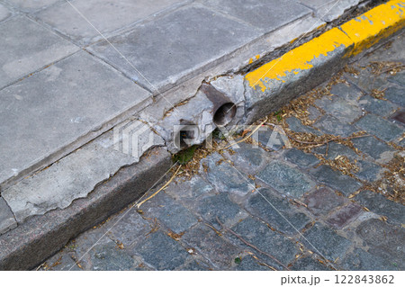A bright yellow curb is located on the side of a road A bright yellow curb is located on the side of a road 122843862