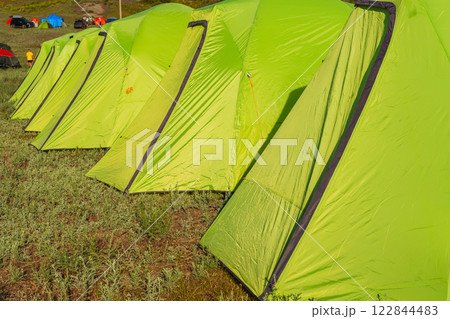 light green synthetic tourist tents in the field of Almaty. tents for sleeping on vacation 122844483