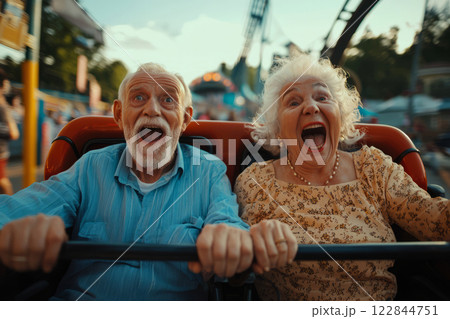 Excited Elderly Couple Riding a Roller Coaster 122844751