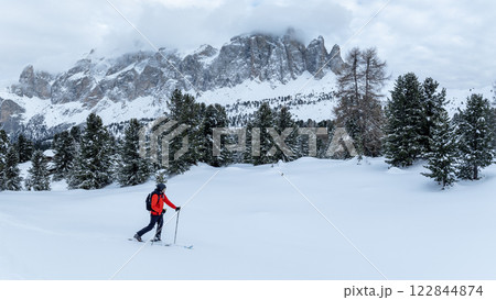 Backcountry Skier Walking in the scenic mountains in Dolomites, Panorama, italy Backcountry Skier Walking in the scenic mountains in Dolomites, Panorama, italy 122844874