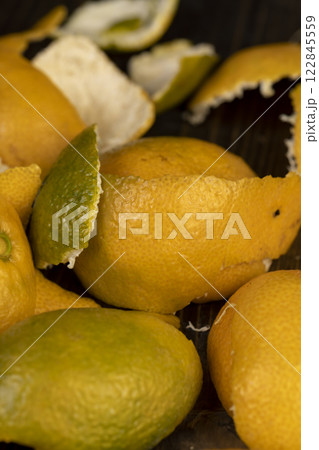 peeled orange ripe tangerines on the table 122845559