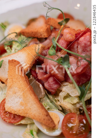 Caesar salad with bacon is mouthwatering and 122846435