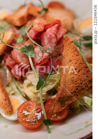 Caesar salad with bacon is mouthwatering and 122846436