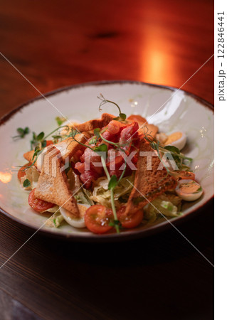 Caesar salad with bacon is mouthwatering and 122846441