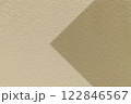 Texture beige paper background, half two colors with brown arrow, macro. Structure dense craft sand cardboard. 122846567