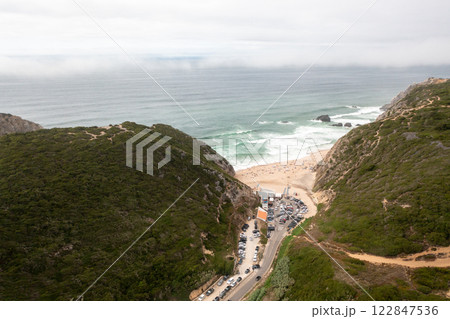 Aerial drone view of parking lot amidst hills at Aerial drone view of parking lot amidst hills at 122847536