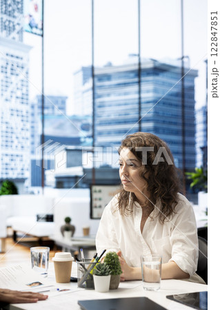 Professional HR worker in office interviewing candidate for post vacancy, asking questions. Human resources manager communicating with candidate during job interview in office 122847851