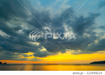 Landscape of colorful clouds in sunset or sunrise sky over sea with reflection in the tropical sea,Beautiful seascape scenery,Amazing light of nature Landscape nature background Landscape of colorful clouds in sunset or sunrise sky over sea with reflection in the tropical sea,Beautiful seascape scenery,Amazing light of nature Landscape nature background 122848223