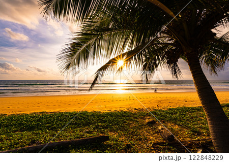 Silhouette coconut palm trees at sunset or sunrise sky over sea, Amazing colorful light sky nature landscape, Beautiful nature sky and clouds background 122848229