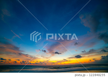 Landscape of colorful clouds in sunset or sunrise sky over sea with reflection in the tropical sea,Beautiful seascape scenery,Amazing light of nature Landscape nature background 122848235
