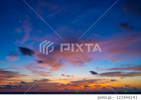 Landscape of colorful clouds in sunset or sunrise sky over sea with reflection in the tropical sea,Beautiful seascape scenery,Amazing light of nature Landscape nature background Landscape of colorful clouds in sunset or sunrise sky over sea with reflection in the tropical sea,Beautiful seascape scenery,Amazing light of nature Landscape nature background 122848241