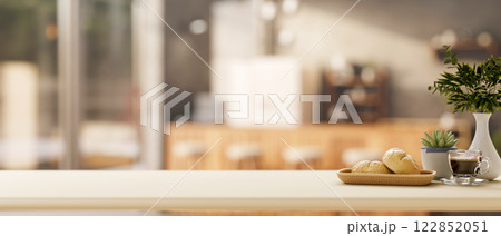 A minimalist white kitchen tabletop set in in a minimalist kitchen or coffee shop. A minimalist white kitchen tabletop set in in a minimalist kitchen or coffee shop. 122852051