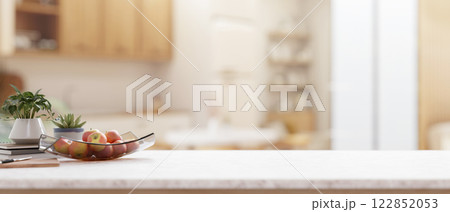 A kitchen countertop with a blurred background of a contemporary Scandinavian kitchen. 122852053