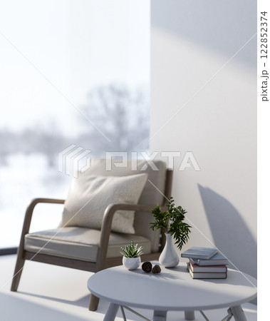 A simple white room with a minimalist armchair and a round white coffee table. 122852374