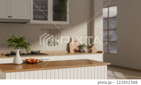 A contemporary Scandinavian home kitchen features a kitchen island and cooking space. A contemporary Scandinavian home kitchen features a kitchen island and cooking space. 122852388