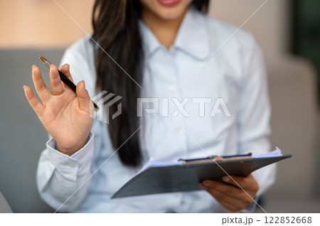 A close-up of a female psychologist or doctor talking to a patient and offering advice in the clinic 122852668
