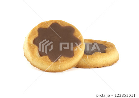Round cookies topped with star-shaped chocolate, perfectly presented against crisp white background. 122853011