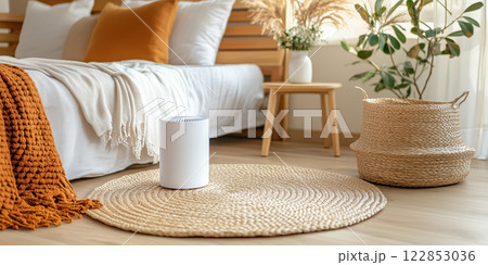 modern white air purifier in cozy living room with natural decor modern white air purifier in cozy living room with natural decor 122853036