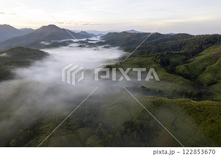 Landscape of Morning Mist with Mountain Layer at north of Thailand. mountain ridge and clouds in rural jungle bush forest 122853670