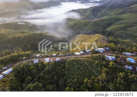Landscape of Morning Mist with Mountain Layer at north of Thailand. mountain ridge and clouds in rural jungle bush forest Landscape of Morning Mist with Mountain Layer at north of Thailand. mountain ridge and clouds in rural jungle bush forest 122853672