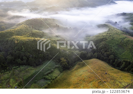 Landscape of Morning Mist with Mountain Layer at north of Thailand. mountain ridge and clouds in rural jungle bush forest 122853674