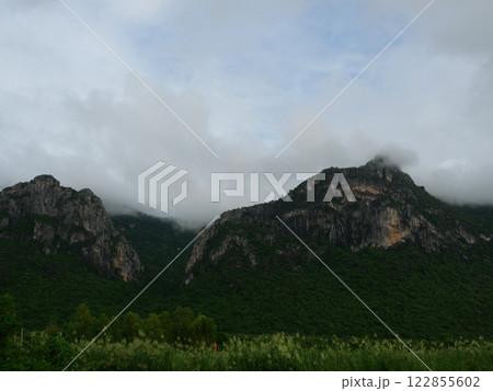 Cloud and fog cover limestone mountain in the rainy season, Green forest and rock at Khao Sam Roi Yot National Park, Thailand Cloud and fog cover limestone mountain in the rainy season, Green forest and rock at Khao Sam Roi Yot National Park, Thailand 122855602
