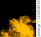 Bright orange cloud of smoke is rising from the ground 122858039