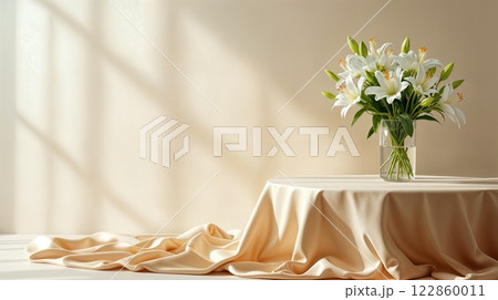 White Lilies in Vase on Draped Table White Lilies in Vase on Draped Table 122860011