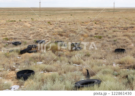 Tire disposal in the desolate steppe of Kazakhstan creates environmental concern Tire disposal in the desolate steppe of Kazakhstan creates environmental concern 122861430