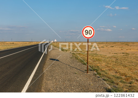Speed limit sign along a vast road in Atyrau Region, Kazakhstan 122861432