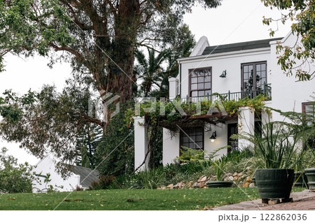 residential building classic architectural style. white facade, dark tiled roof 122862036