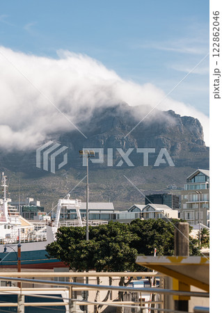 Cape Town waterfront cityscape, buildings and Table Mountain in clouds 122862046