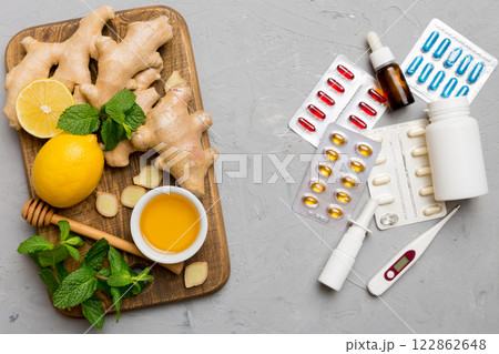 Natural cold and flu home remedies. Natural ingredients for immunity stimulation and viruses protection. top view flat lay Natural cold and flu home remedies. Natural ingredients for immunity stimulation and viruses protection. top view flat lay 122862648
