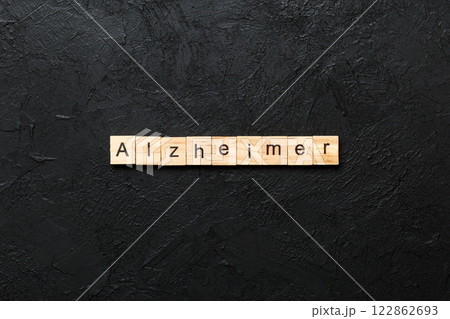 Alzheimer word written on wood block. Alzheimer text on cement table for your desing, concept Alzheimer word written on wood block. Alzheimer text on cement table for your desing, concept 122862693