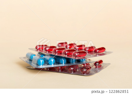 too many different pill cartridges stacked. selective Focus. Packs of blister pills with tablets. Colored pastilles packages. A pile of medicine in blister packs. Pharmaceutical blister packs too many different pill cartridges stacked. selective Focus. Packs of blister pills with tablets. Colored pastilles packages. A pile of medicine in blister packs. Pharmaceutical blister packs 122862851