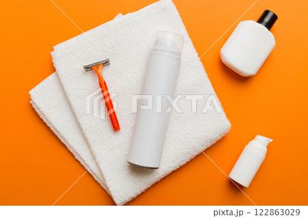 shaving man set. shaving machine, towel, lotion and shaving foam on colored background. Men bath Accessories top view shaving man set. shaving machine, towel, lotion and shaving foam on colored background. Men bath Accessories top view 122863029