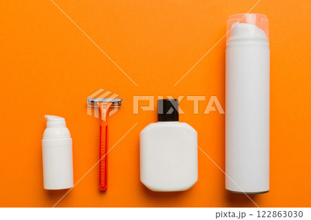 shaving man set. shaving machine, towel, lotion and shaving foam on colored background. Men bath Accessories top view shaving man set. shaving machine, towel, lotion and shaving foam on colored background. Men bath Accessories top view 122863030