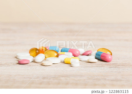 Collection Of Various Medical Tablets And Pills. Assorted pharmaceutical medicine pills, tablets and capsules on table background. Heap of assorted various medicine tablets. Health care 122863115