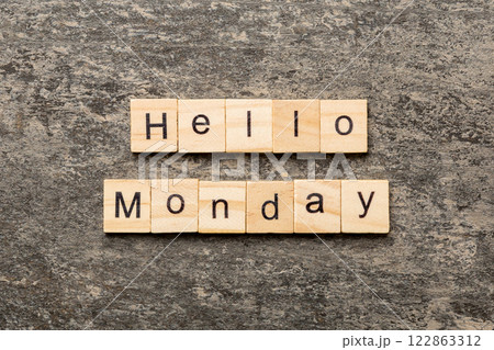 hello monday word written on wood block. hello monday text on cement table for your desing, concept hello monday word written on wood block. hello monday text on cement table for your desing, concept 122863312