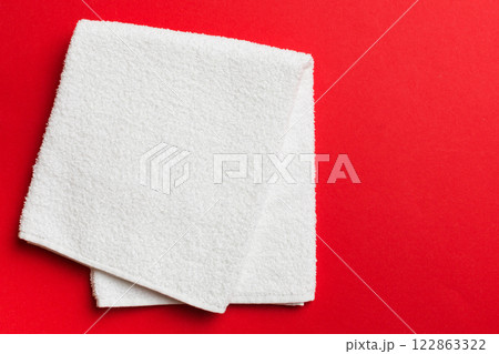 Top view of white towels with copy space on colored background 122863322