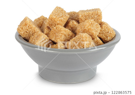 brown sugar in a ceramic bowl isolated on white background brown sugar in a ceramic bowl isolated on white background 122863575