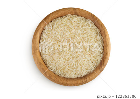 rice basmati in a wooden bowl isolated on white background. Top view. Flat lay rice basmati in a wooden bowl isolated on white background. Top view. Flat lay 122863586